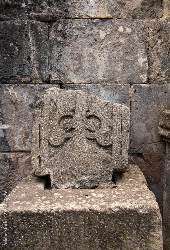 Close-up of medieval Armenian stone cross Khachkar showing detailed relief carving