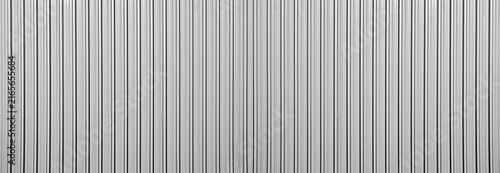Konstfotografi Silver tin iron corrugated wall with horizontal stripes from a metal profile of a metal sheet