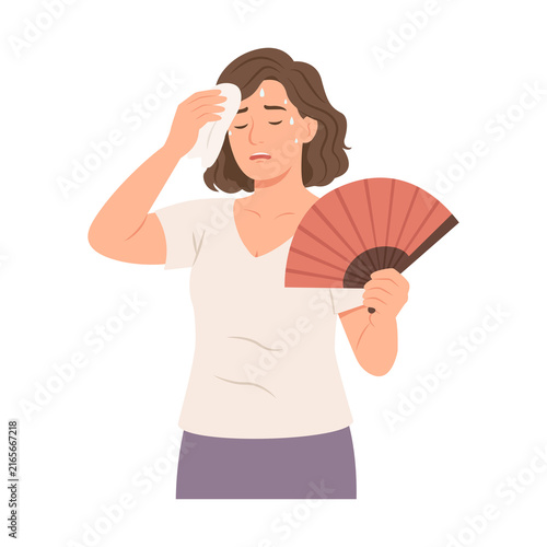Foto Attractive woman  using hand fan to cool down