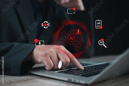 Business professional using laptop with AI warning interface, highlighting financial risk, automation errors, data analysis and artificial intelligence challenges in digital technology.