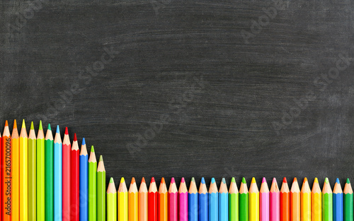 Colorful Pencils Framing Blank Chalkboard Background with Large Copy Space