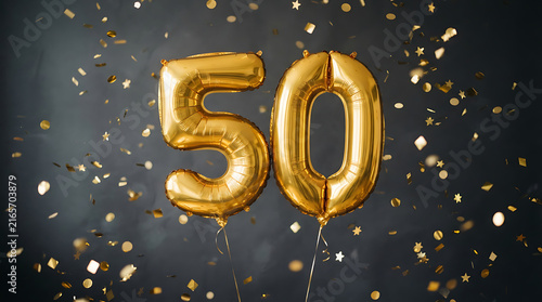 Fifty gold number balloons floating with shiny confetti for anniversary birthday celebration.