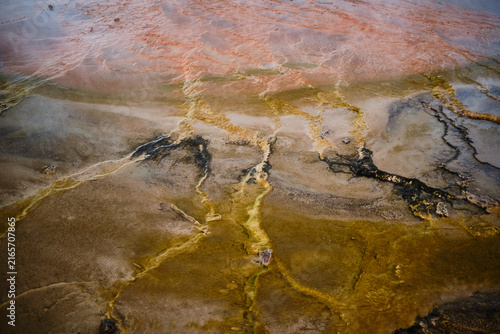 Obraz na płótnie Geothermal stream creating colorful mineral patterns in el tatio