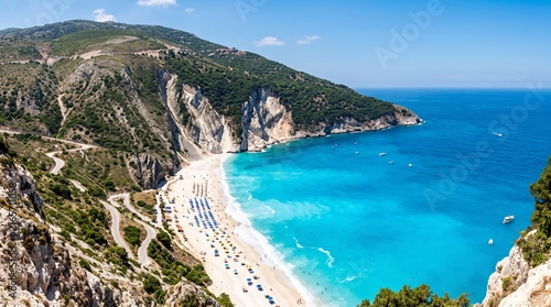 Idyllic Mediterranean beach with turquoise water and white sand surrounded by dramatic cliffs and lush green hills perfect for travel and vacation themes