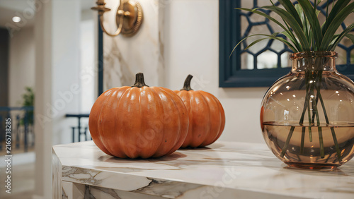 Halloween pumpkin decoration on marble countertop with autumn leaves and candlelight ambiance