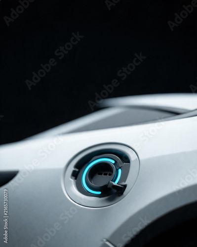 Macro close-up of electric vehicle charging port with blue LED indicator ring