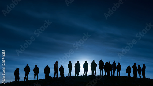 Silhouettes of diverse individuals against a moody twilight backdrop, highlighting a sense of unity and contemplation.