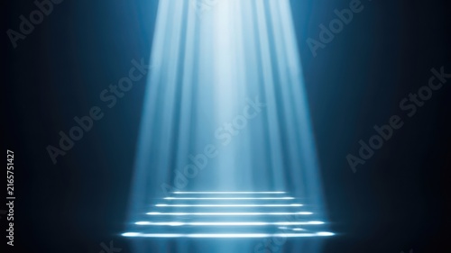 Bright stage lights shining down on dark background