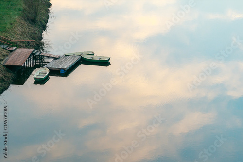 Canvas Print Boats Floating on a Mirror Like River Sky Reflected Below