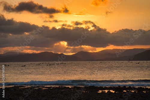 Sun Dips Below the Waves