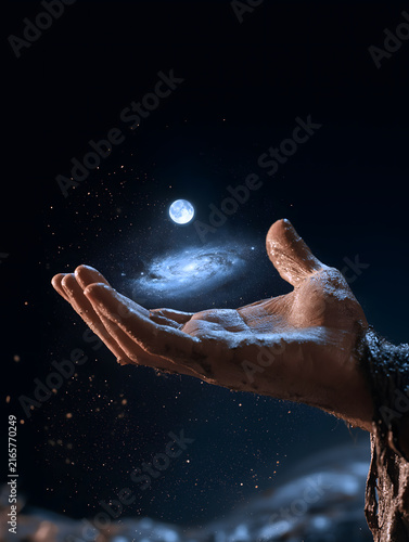 Ancient moon worship abstract visual, miniature galaxy and full moon in open palm, dark cosmic background, nebula light illuminating skin texture, commercial asset for poster, packaging, education and