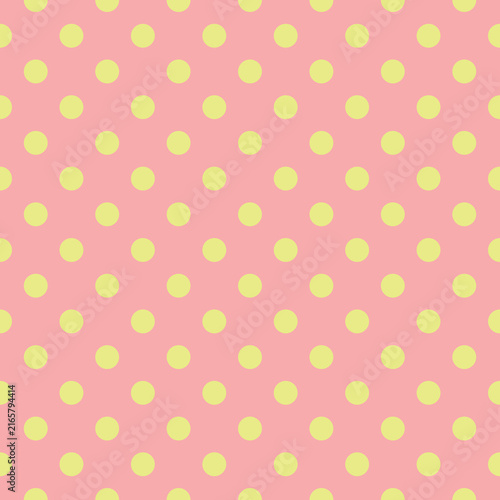 Cute Seamless Pattern with Pale Yellow Polka Dots on a Soft Pastel Pink Background - Ideal for Nursery Decor, Gift Wrapping Paper, Scrapbooking, and Fashion Textiles.
