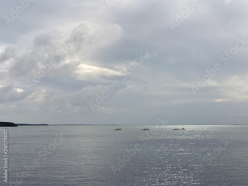 Fotografie Light breaks through the clouds and lights up the waters of Biscayne Bay off Ell