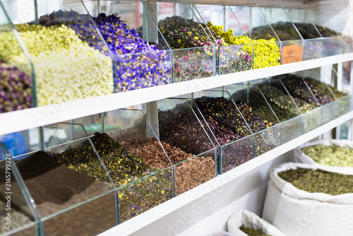 Fotografie Dried teas herbs and flowers displayed in glass bins at an oriental bazaar in Bukhara Uzbekistan