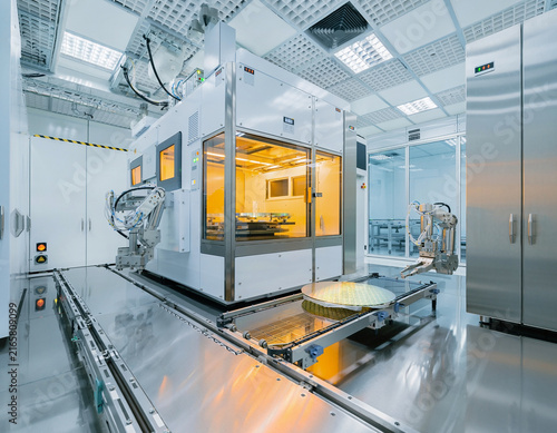 A hyper-realistic, wide-angle interior view of an advanced semiconductor manufacturing.