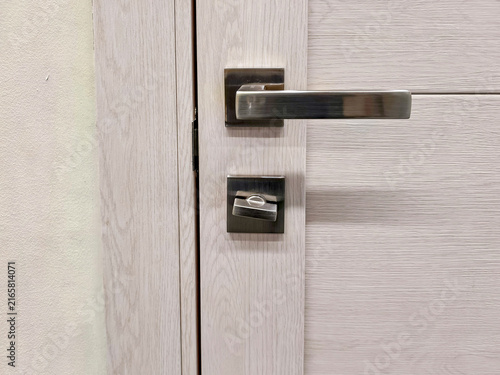 Obraz na płótnie Modern satin nickel door handle with thumb turn deadbolt lock on interior wooden