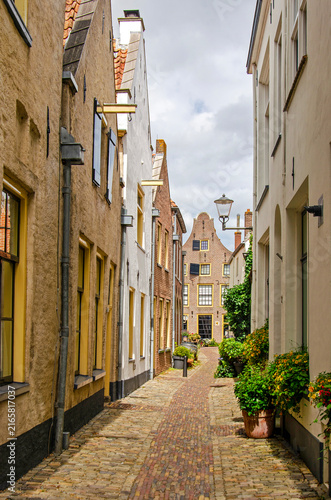 Hattem, The Netherlands, July 22, 2026: alley in the old town lined with houses with brick and plaster facades