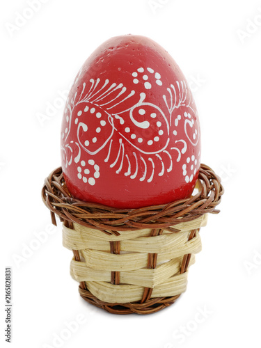 Bild auf Leinwand decorated easter egg in a wicker basket, Bucharest, Romania
