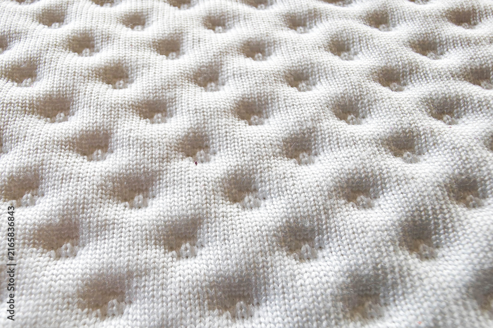 Fototapeta premium White quilted fabric texture with soft dimpled pattern for bedding or upholstery background