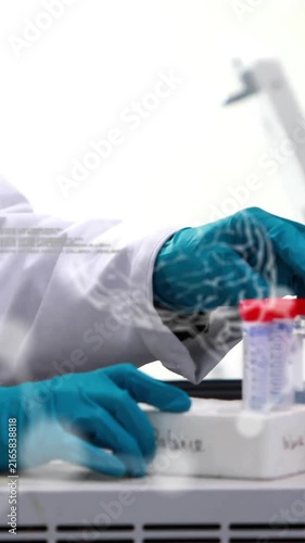 Animation of chemical formula and data processing over male scientist taking samples in lab