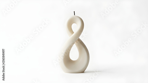 Minimalist infinity shape soy wax candle on white background, modern sculpted twist pillar candle art, aesthetic neutral beige infinity loop candle centerpiece for home interior decoration display
