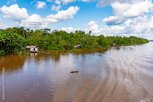 River dweller lifestyle: Local people in a canoe on the Amazon River, Belem, Para