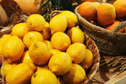 Obraz na plátne Fresh lemons form abundant market display