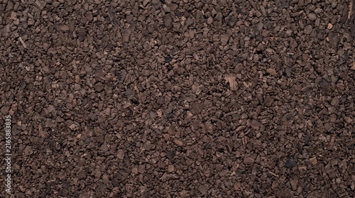 Dark Brown Granulated Cork Surface Texture Background