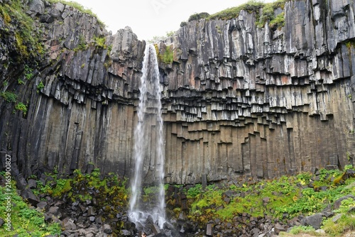 Canvastavla Svartifoss - meaning Black Falls - is a famous 20-meter waterfall located in the Skaftafell Nature Reserve within Vatnajokull National Park in southeast Iceland