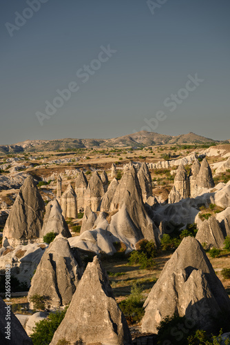 Quadro su tela Fairy chimneys rock formations in Love Valley Cappadocia, peri bacalar, unique volcanic landscape panorama in Goreme Turkey, scenic geology and famous tourist attraction background