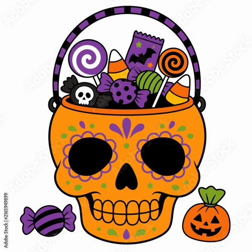 Orange sugar skull basket filled with assorted Halloween candies and sweets on white.