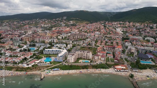 Aerial drone view of houses with red tiles and hotels, sea and beaches of Sveti Vlas in Bulgaria from above, top view from drone. Summer holiday in Europe. Black sea
