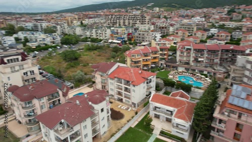 Panoramic aerial view of houses and hotels with pool, residential apartment, sea and beaches of Sveti Vlas in Bulgaria from above, top view from drone. Summer holiday in Europe. 

