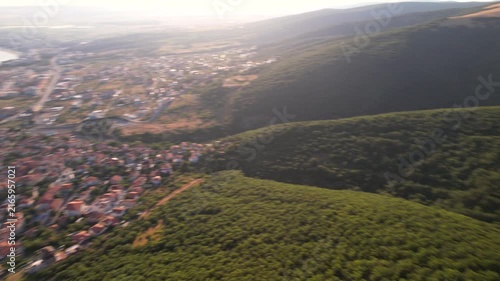 Panoramic aerial view of houses and hotels, near mountains, sea and beaches of Sveti Vlas in Bulgaria from above, top view from drone. Summer holiday in Europe. 
