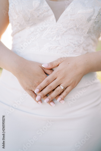 Photography Bride Hands with French Manicure and Lace Dress Detail