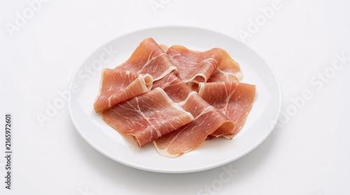 slices of parma ham on plate