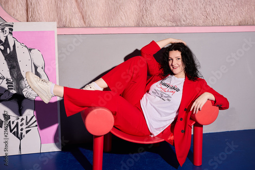 Elegant woman in red blazer during creative photo session