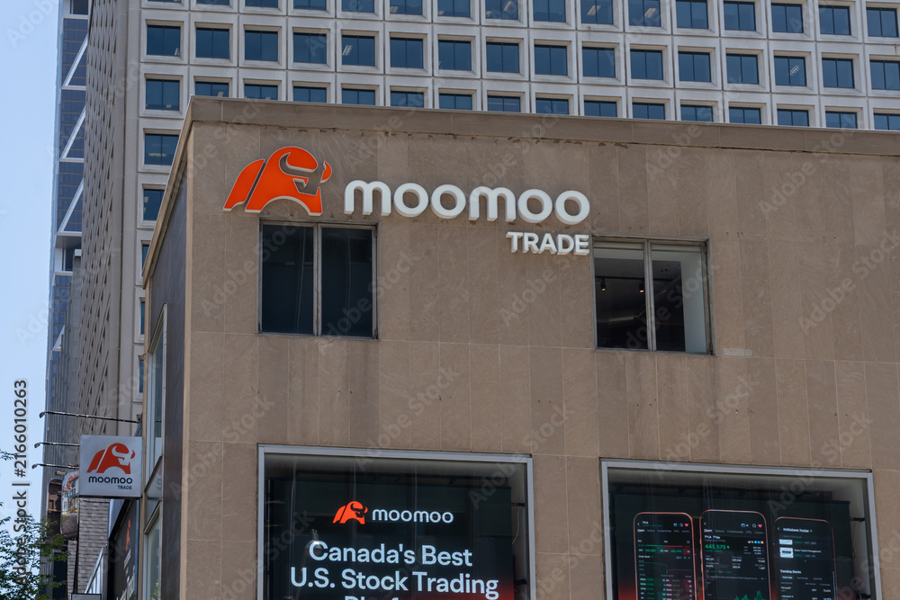 Fototapeta premium Toronto, ON, Canada - August 21, 2026: The flagship store of Moomoo Financial Canada on Bloor Street West in downtown Toronto, ON, Canada. Moomoo is a Hong Kong global retail stock brokerage and onli