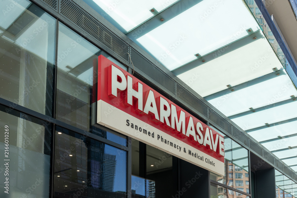 Fototapeta premium Toronto, ON, Canada - August 21, 2026: The sign displays the storefront for Pharmasave (Sanomed Pharmacy and Medical Clinic) on Bay Street, Toronto, ON, Canada. 