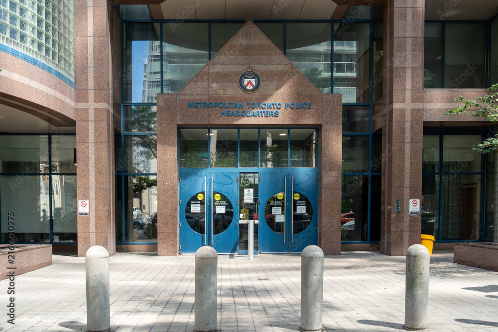 Fototapeta premium Toronto, ON, Canada - August 21, 2026: The entrance of the Toronto Police Headquarters in downtown Toronto, Ontario, Canada. 