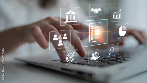 Businessman Using Laptop with Abstract Icons Representing Digital Solutions and Financial Data for Effective Management and Analysis in Modern Workplace. Bitwise.