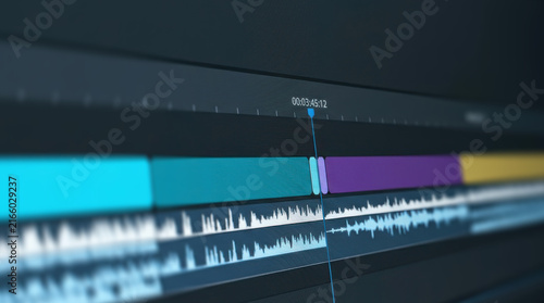 Digital audio and video editing software interface displaying sound waveforms and media tracks for professional post production workflow