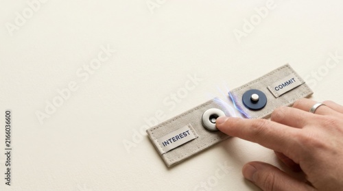 Obraz na płótnie Customer conversion visualized as the moment interest transforms into a committed relationship with a hand turning a button