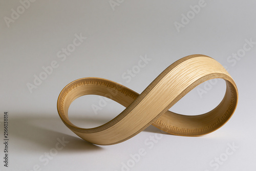 Wooden ruler twisted into a Mobius strip surreal geometry concept