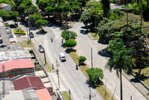 Aerial view of Avenida del Rio and surrounding streets in Dosquebradas, Colombia. ambulance passing