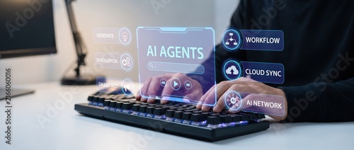 Close up of hands typing on a keyboard with futuristic ai interface displaying various features including cloud sync and workflow management on a modern desk.