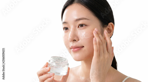 Clean beauty face cream application, smooth skin application, moisture cream jar, cosmetics cream usage, natural white background