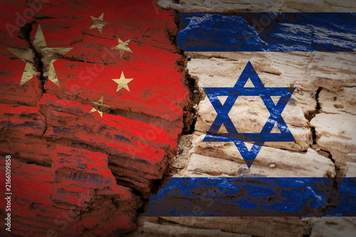 China and Israel flags on cracked wood symbolizing geopolitical tension and conflict.