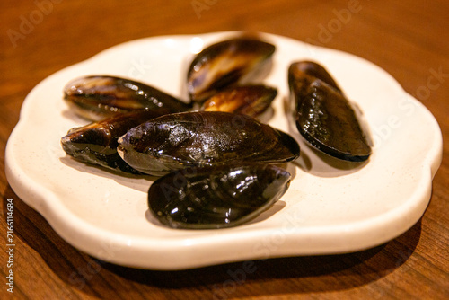 Photography Cooked black mussels appetizer plate