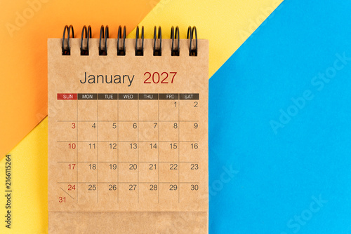January 2027 brown color mini calendar on colorful background.